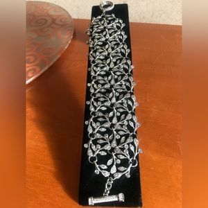 Nadri wide bracelet with crystals in silver tone setting. No box.